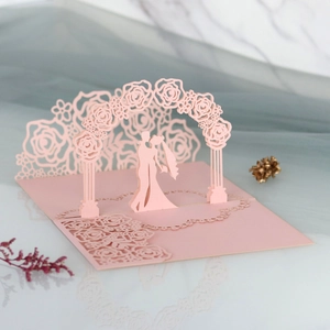 Detailed 3D laser-cut rose arch wedding invitation card in romantic pale pink finish