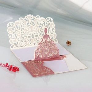 Intricate laser-cut bridal silhouette invitation with glitter details and lace texture