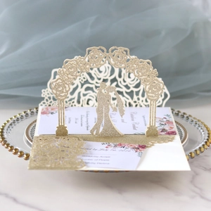 3D laser cut gold glitter wedding invitation with 3D roses and couple silhouette