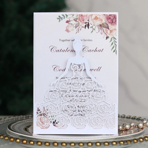 Elegant laser-cut wedding invitation with pink watercolor flowers and lace bridal design