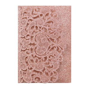 Detail of rose gold laser-cut invitation featuring intricate lace floral patterns