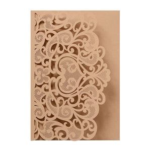 Detail showing intricate laser-cut heart patterns on brown kraft paper wedding invitation