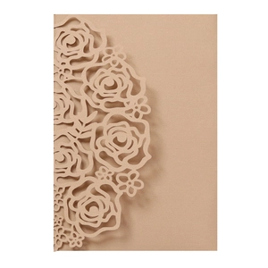 Detailed laser-cut rose floral pattern on kraft paper wedding invitation cover