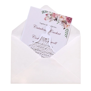 Laser-cut wedding invitation featuring a white lace bridal dress design and floral card