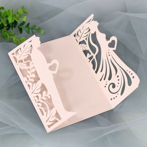 Detailed laser-cut wedding invitation featuring a romantic silhouette of a bride and groom