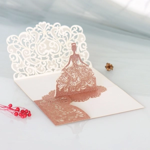 Detailed 3D laser cut card featuring a rose gold sequined elegant dress design