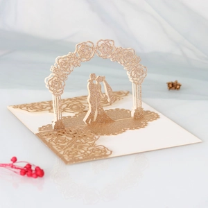 3D laser cut wedding card with glitter gold arch and couple silhouette detail