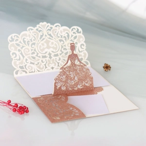 Detail of 3D laser-cut girl silhouette invitation card with rose gold glitter finish
