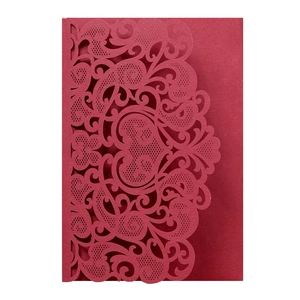 Intricate laser-cut heart and floral lace patterns on burgundy festive invitation card