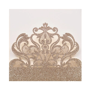Detailed laser-cut champagne gold glitter invitation cover with baroque floral patterns