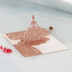 Detail of rose gold glitter card featuring a laser-cut 3D princess design for weddings