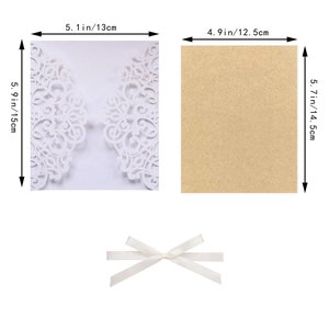 Laser cut white butterfly invitation with brown kraft inner card and white silk ribbon