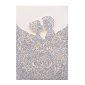 Detailed laser-cut wedding invitation featuring a silver glitter bride and groom silhouette