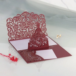 Detailed laser-cut 3D pop-up wedding card featuring an elegant burgundy lace girl design