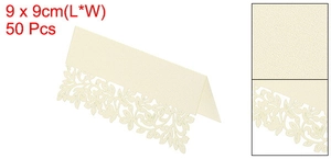 Macro detail of laser-cut leaf pattern on pearlescent 9x9cm ivory cardstock