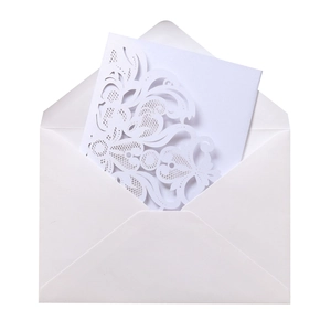 Laser cut floral wedding invitation with intricate lace details and white envelope set