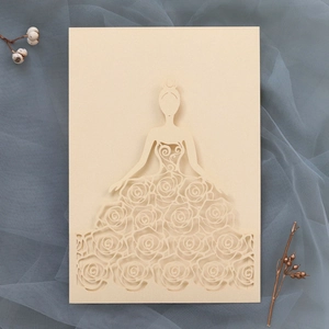 Detail of laser-cut rose floral dress silhouette on elegant beige wedding invitation