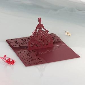 Detail showing the intricate laser-cut floral lace on a 3D pop-up wedding invitation card
