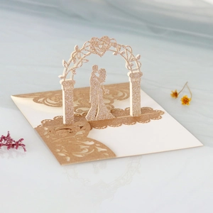 3D laser cut wedding invitation card with kissing couple under floral arch