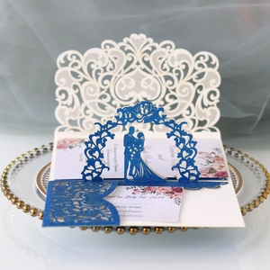 Elegant laser-cut lace wedding invitation set with 3D pop-up arch and ivory floral details