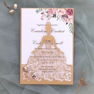 Detail of laser-cut gold-brown wedding invitation with elegant rose bride silhouette