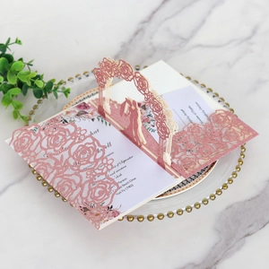 Detailed laser-cut rose wedding invitation with 3D bride and groom silhouette and glitter finish