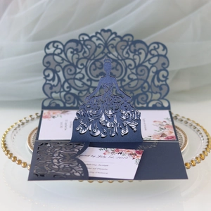 Navy blue laser cut wedding invitation with bridal silhouette and floral insert detail