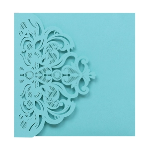 Detail of light blue laser-cut lace pattern on an elegant square wedding invitation
