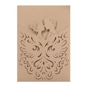 Detail of laser-cut kraft cardstock wedding invitation with couple silhouette and wing pattern