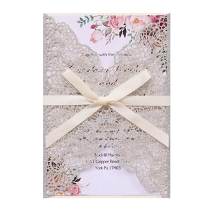 Silver glitter laser-cut wedding invitation card with ivory ribbon and floral inner sheet