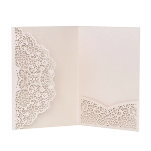 Detailed laser cut lace wedding invitation cover in champagne pearlescent paper finish