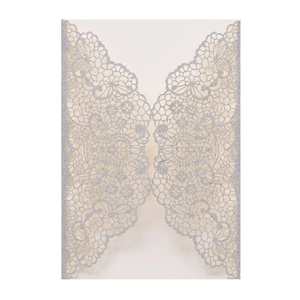 Detail showing the intricate laser-cut floral lace texture on silver glitter wedding card