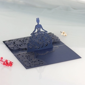 Detail of laser-cut 3D pop-up girl in ball gown for dark blue luxury wedding invitations