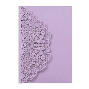 Detail of lavender laser-cut lace pattern on an elegant wedding invitation card
