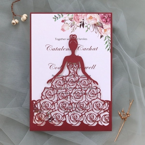 Burgundy laser cut wedding invitation with rose bride silhouette on grey tulle backdrop