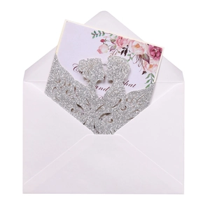 Laser cut wedding invitation with silver glitter outer shell and floral printed insert