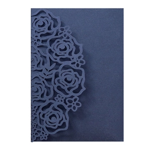 Detailed laser-cut navy blue floral wedding invitation cover with rose patterns