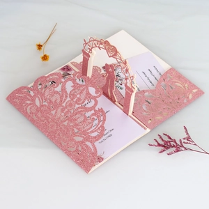 Macro view of 3D rose laser cut wedding invitation with glitter finish and pop-up design