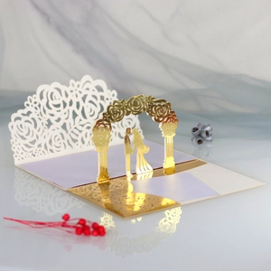 Detailed laser cut 3D wedding invitation with gold foil silhouette and floral pattern