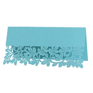 Detailed laser-cut leaf patterns on light blue glitter paper place card for table settings