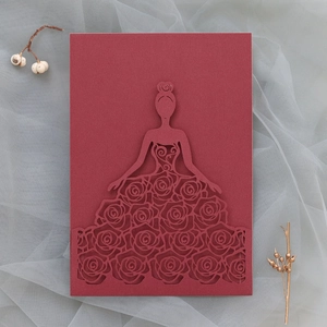 Detailed laser-cut dark red wedding invitation featuring elegant rose dress female silhouette