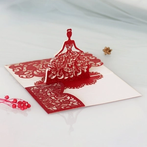 Detail of laser-cut 3D bridal greeting card with glitter finish and red floral accents