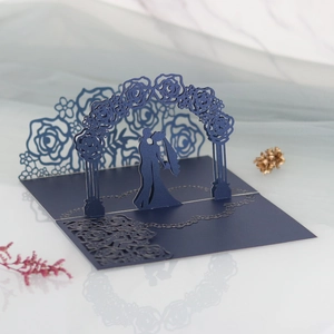 Detailed 3D laser-cut wedding invitation featuring a romantic navy blue rose arch design
