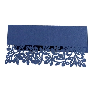 Deep blue laser-cut wedding table place card with intricate leaf and flower pattern