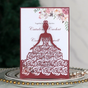 Detailed laser-cut bride and rose pattern on elegant burgundy wedding invitation cards