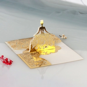 Macro view of 3D laser-cut golden princess card with intricate lace and crown details