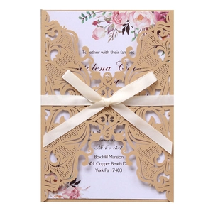 Lace laser cut wedding invitation with floral inner card and cream ribbon bow tie