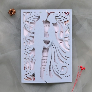 Detailed laser-cut lavender wedding invitation with elegant couple silhouette design