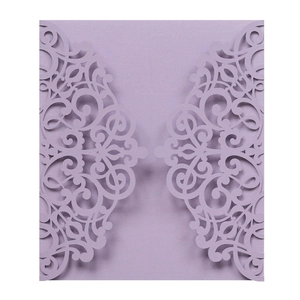 Detailed laser-cut lavender wedding invitation featuring intricate floral patterns