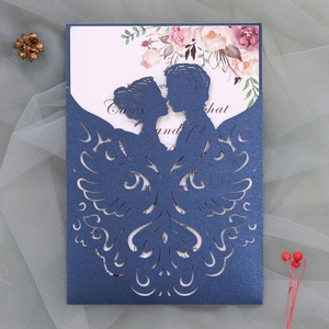 Laser cut navy blue glitter wedding invitation featuring an elegant couple silhouette detail